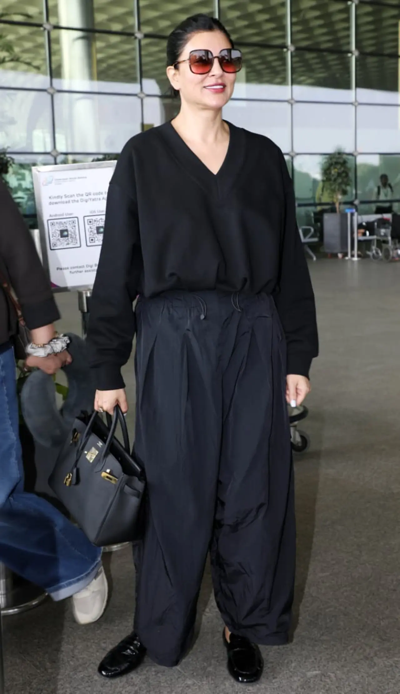 Sushmita Sen kept it stylish at the airport in a black co-ord set. She paired the look with comfy footwear and minimal accessories, keeping it chic, easy, and perfect for travel.